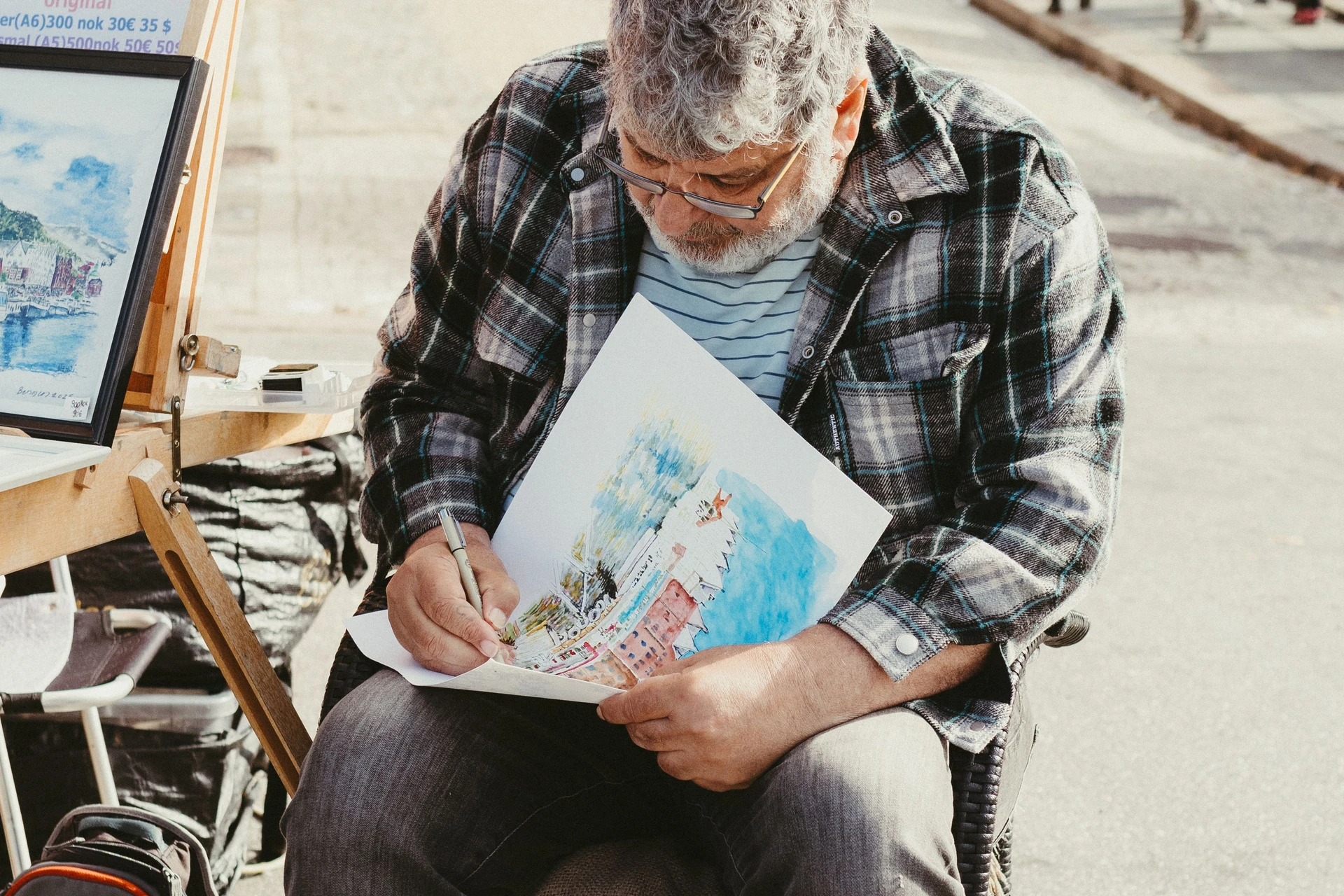 Man sketching European architecture outdoors