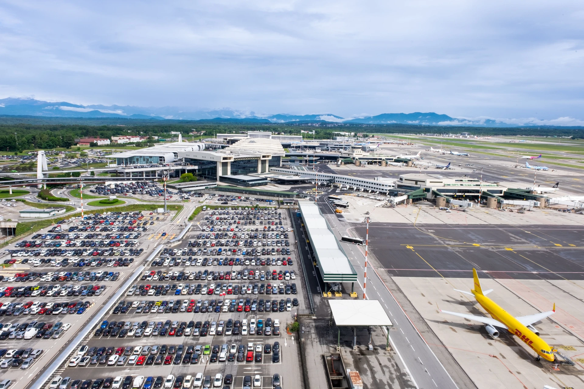 Airport with view of runway and distant city landscape
